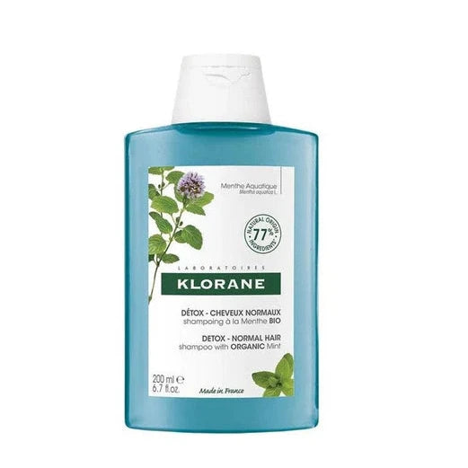 Klorane shampoo bottle with mint leaf illustration
